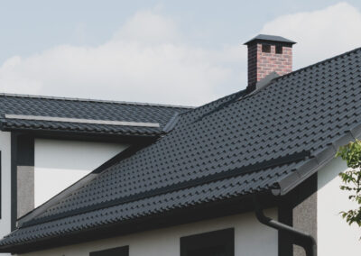 The dark-colored roof of a new residential private house